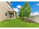 Spacious backyard with healthy green grass, tall privacy fence, and covered lanai at 1722 Lake Sims Pkwy, Ocoee, FL 34761