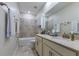 This bathroom features a double sink vanity and a shower over the tub at 1722 Lake Sims Pkwy, Ocoee, FL 34761