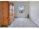 This bedroom has neutral paint, carpet flooring, and a bright window view at 1722 Lake Sims Pkwy, Ocoee, FL 34761