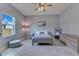 Bright bedroom with ceiling fan at 1722 Lake Sims Pkwy, Ocoee, FL 34761