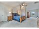 Spacious bedroom with four poster bed and ceiling fan at 1722 Lake Sims Pkwy, Ocoee, FL 34761