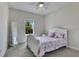 Light filled bedroom with carpet, ceiling fan, window and furniture at 1722 Lake Sims Pkwy, Ocoee, FL 34761