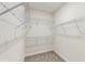 Walk-in closet with wire shelving and carpeted floor at 1722 Lake Sims Pkwy, Ocoee, FL 34761