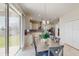 Dining area with sliding glass doors leading to the backyard and an adjacent modern kitchen at 1722 Lake Sims Pkwy, Ocoee, FL 34761