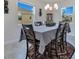 Dining room with chandelier and large windows at 1722 Lake Sims Pkwy, Ocoee, FL 34761
