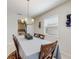 Elegant dining room featuring a large table, modern chandelier, and stylish decor at 1722 Lake Sims Pkwy, Ocoee, FL 34761