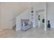 Welcoming entryway with tile flooring, coat rack, and stylish bench seating at 1722 Lake Sims Pkwy, Ocoee, FL 34761