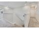 Bright upstairs hallway with carpet and neutral paint at 1722 Lake Sims Pkwy, Ocoee, FL 34761