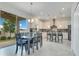 Eat-in kitchen features an island with seating and sliding glass doors to the backyard at 1722 Lake Sims Pkwy, Ocoee, FL 34761