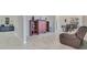 Comfortable living room with a leather recliner and wood shelving at 1722 Lake Sims Pkwy, Ocoee, FL 34761