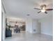 Bright, airy living room with an open layout flowing into the kitchen and dining area at 1722 Lake Sims Pkwy, Ocoee, FL 34761