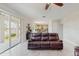 Open-concept living room flowing into the dining area and kitchen, featuring a sliding glass door at 1722 Lake Sims Pkwy, Ocoee, FL 34761