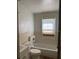 Bathroom featuring a toilet, sink, and bathtub at 1803 S Westmoreland Dr, Orlando, FL 32805