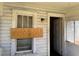 Exterior shot of an entrance to a home with boarded up windows at 1803 S Westmoreland Dr, Orlando, FL 32805