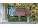 Aerial view of the home highlighting the backyard pool and patio with lush lawn at 1818 S Oak Ave, Sanford, FL 32771