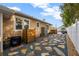 Backyard patio with gravel and stone pavers, wood privacy screen, lush landscaping, and cold plunge at 1818 S Oak Ave, Sanford, FL 32771