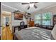 Cozy bedroom with a work desk, hardwood flooring, and an abundance of natural light at 1818 S Oak Ave, Sanford, FL 32771