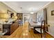 Dining room featuring hardwood floors, stylish furnishings, and an open view to the kitchen at 1818 S Oak Ave, Sanford, FL 32771