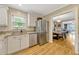 Kitchen with stainless steel appliances and granite countertops, flowing into the dining room at 1818 S Oak Ave, Sanford, FL 32771