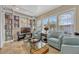 Sitting area featuring bright windows and built-in shelving with books and entertainment center at 1818 S Oak Ave, Sanford, FL 32771