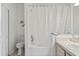 Cozy bathroom featuring a shower-tub combo with a shower curtain and neutral-toned vanity at 215 Elderberry Dr, Davenport, FL 33897