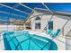 Inviting screened-in pool area with a sparkling pool and comfortable seating for outdoor relaxation and entertaining at 215 Elderberry Dr, Davenport, FL 33897