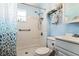 Bathroom featuring a white-tiled shower, toilet, and vanity sink at 24813 E Highway 316, Salt Springs, FL 32134