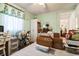 Open view of a green bedroom with a desk, wardrobe, and floral curtains at 24813 E Highway 316, Salt Springs, FL 32134