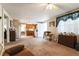 Inviting living room showcasing an open floor plan with neutral tones and ceiling fan at 24813 E Highway 316, Salt Springs, FL 32134