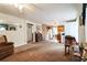 View of the neutral-toned living room showcasing an open floor plan with a ceiling fan at 24813 E Highway 316, Salt Springs, FL 32134