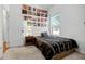 Cozy bedroom with a black bedspread, record albums as decor, and natural light at 252 Longhirst Loop, Ocoee, FL 34761