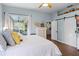 Bedroom featuring sliding glass doors to screened porch, dresser and closet at 252 Longhirst Loop, Ocoee, FL 34761