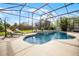 The screened-in pool area is perfect for relaxation, with a unique water feature and ample space for lounging at 252 Longhirst Loop, Ocoee, FL 34761