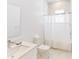 Clean bathroom featuring a single sink, white marble floors and a shower with modern fixtures at 257 Famagusta Dr, Davenport, FL 33896