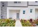 Contemporary townhome exterior with gray accents, manicured landscaping, and a welcoming entrance at 257 Famagusta Dr, Davenport, FL 33896