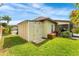 Backyard shed and lush green lawn providing practical storage and serene outdoor space at 2726 Babbitt Ave, Orlando, FL 32833