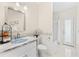 Bright bathroom featuring a marble countertop sink, modern fixtures, a bathtub, and outdoor access at 2726 Babbitt Ave, Orlando, FL 32833