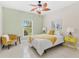 Bedroom featuring a stylish ceiling fan, sunny window view and decorative accent furniture with light green paint at 2726 Babbitt Ave, Orlando, FL 32833