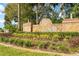 Wedgefield community entrance sign with brickwork, landscaping, and sunny skies at 2726 Babbitt Ave, Orlando, FL 32833