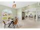 Dining room with view of living area, front entrance, and plenty of natural light at 2726 Babbitt Ave, Orlando, FL 32833