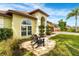 Welcoming front yard showcases an arched entrance, lush landscaping, and a comfortable seating area at 2726 Babbitt Ave, Orlando, FL 32833