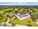 Aerial view showcases golf club, clubhouse, parking, and beautiful landscape at 2726 Babbitt Ave, Orlando, FL 32833