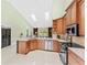 Kitchen boasts stainless steel appliances, granite countertops, and an open layout with skylights at 2726 Babbitt Ave, Orlando, FL 32833