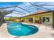 Relaxing screened-in pool area with a sparkling pool, patio furniture, and ample lounging space at 2726 Babbitt Ave, Orlando, FL 32833