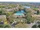 Community aerial view showing the pool, clubhouse, fountain lake, and surrounding landscape at 2847 Metro Sevilla Dr # 103, Orlando, FL 32835