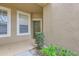 Inviting entryway featuring a decorative door and manicured landscaping at 2847 Metro Sevilla Dr # 103, Orlando, FL 32835