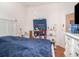 Bedroom with wood floors, white walls, light-colored furniture, and bright decor at 3726 Mount Hope Loop, Leesburg, FL 34748