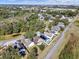 An aerial view of a community with lush trees and well maintained residential homes, some of which have pools at 380 Morning Glory Dr, Lake Mary, FL 32746