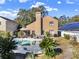 Backyard with a pool, seating, grill and a view of the house's exterior at 380 Morning Glory Dr, Lake Mary, FL 32746