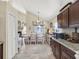 Bright dining room with a large table, white chairs, and lots of natural light at 380 Morning Glory Dr, Lake Mary, FL 32746